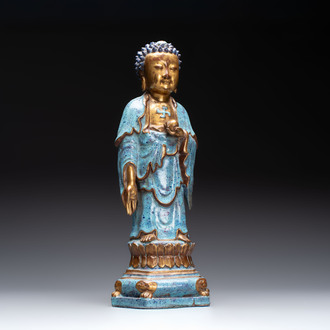 A Chinese robin's egg-glazed gilt-decorated standing Buddha, 18th C.