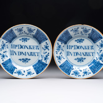 A pair of blue and white Dutch Delft inscribed plates, 18th C.