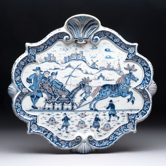 A blue, white and manganese Dutch Delft plaque with a winter scene, 18th C.