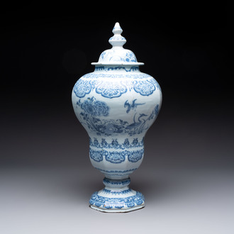 A blue and white Dutch Delft baluster vase and cover with birds among flowering branches, late 17th C.