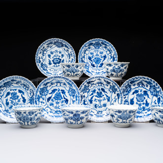 A set of six Chinese blue and white cups and saucers with floral design, Kangxi