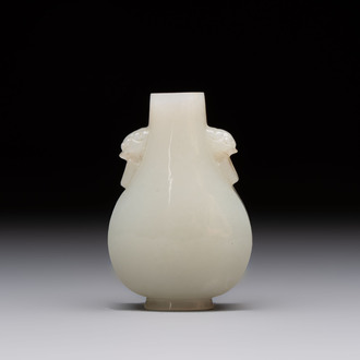 A Chinese white jade snuff bottle with lion-form handles, 19th C.