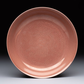 A Chinese copper-red-glazed incised 'dragon' plate, Guangxu mark and possibly of the period