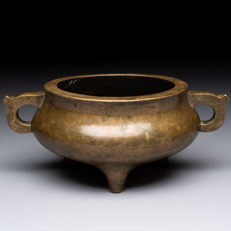 A Chinese bronze two-handled tripod censer, 19th C.