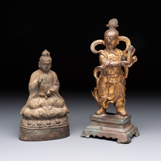 A Chinese bronze Taoist figure and a gilt-lacquered guardian, Ming
