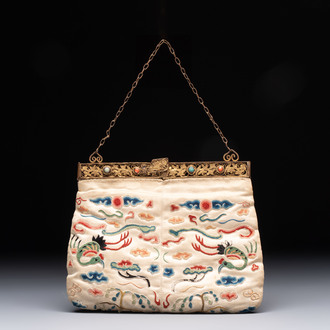 A Chinese embroidered silk purse with red coral- and turquoise-inlaid gilt-bronze mounts, Qing