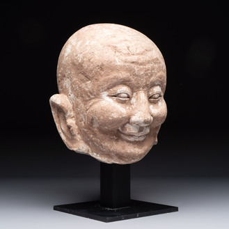 A Chinese sandstone head of a Luohan, Ming