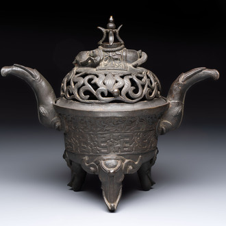 A Chinese bronze 'elephant' tripod censer and cover, Ming