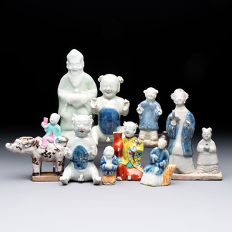 Nine Chinese blue, white, celadon-glazed and famille rose figures, 18/19th C.