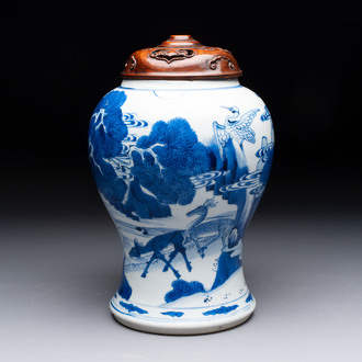 A Chinese blue and white 'He Lu Tong Chun 鶴鹿同春' vase and a wooden cover, Kangxi