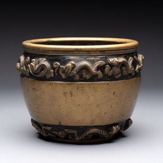 A Chinese bronze cylindrical censer with relief dragon design, Xuande mark, 18/19th C.