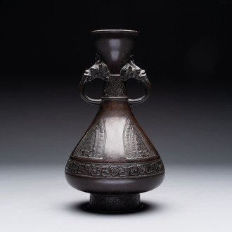 A Chinese archaistic bronze vase with dragon-form handles, Yuan/Ming