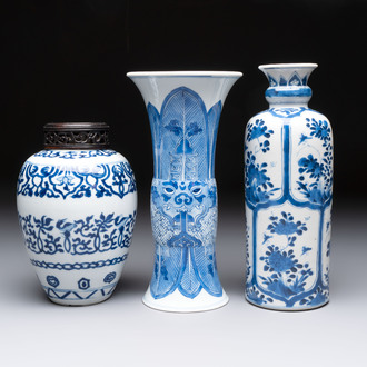 Three Chinese blue and white vases, one with wooden cover, Kangxi