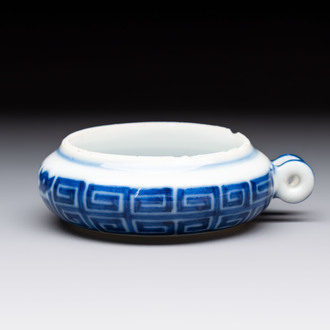 A fine Chinese archaistic blue and white bird feeder with chilong design, Qianlong mark and of the period