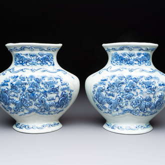 A pair of Chinese blue and white celadon-ground 'Buddhist lions' wall pocket vases, Yongzheng mark, 19/20th C.