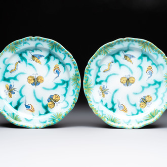 A pair of polychrome Brussels faience plates with butterflies and caterpillars, 18th C.