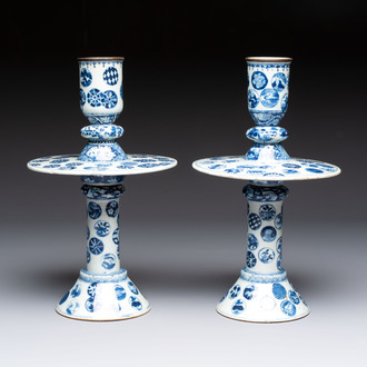 A pair of Chinese blue and white two-piece candle stick holders with brocade ball design for the Southeast Asian market, 19th C.