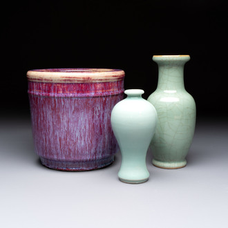 A Chinese flambé-glazed cylindrical jardinière and two celadon-glazed vases, 19th C.
