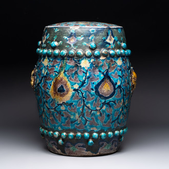 A Chinese Fahua barrel-shaped 'lotus scroll' stool with incised design, Ming