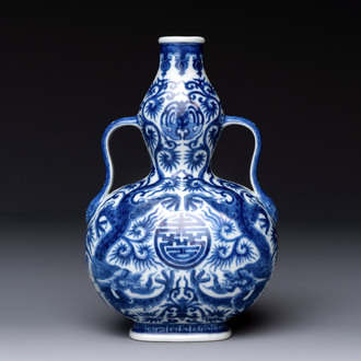 A rare and fine Chinese blue and white double gourd 'dragon' vase with ruyi handles, Qianlong mark and of the period