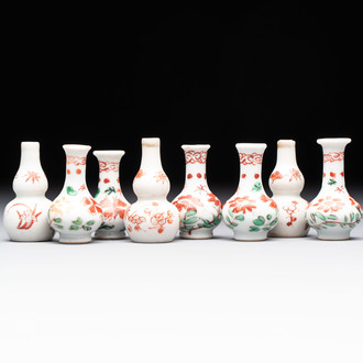 Eight Chinese wucai and gilt-iron-red miniature vases with floral design, Kangxi