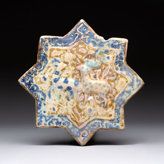 A Kashan lustre-glazed relief-moulded star tile, Iran, 13th C.