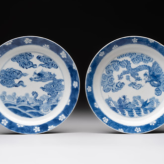 A pair of Chinese blue and white 'dragon' plates, Kangxi mark and of the period