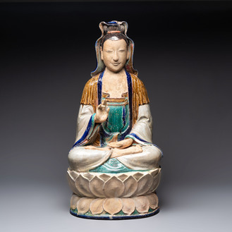 A large Chinese polychrome-glazed Shiwan stoneware figure of Guanyin, 19th C.
