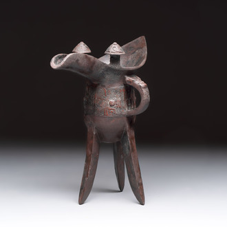 A Chinese archaic bronze wine vessel with Taotie design, 'Jue 爵', Zhou