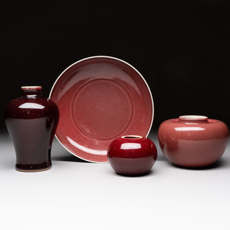 A Chinese copper-red-glazed plate, a meiping vase and two water pots, Kangxi marks, 19/20th C.