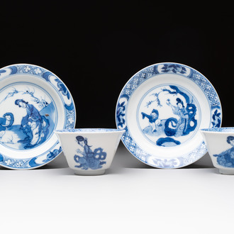 A pair of Chinese blue and white 'Elegant Beauty and Boy' cups and saucers, Chenghua mark, Kangxi