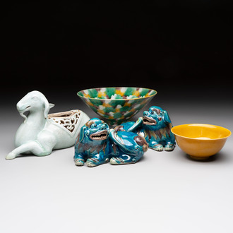 A pair of Chinese polychrome lions, a celadon-glazed goat, a yellow-glazed bowl and a sancai-glazed conical bowl, Chenghua mark, 19/20th C.