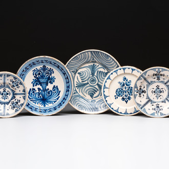 Three blue and white Spanish pottery plates, a dish and a tazza with floral design, Talavera, 19th C.