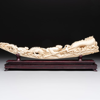 A Chinese ivory carving depicting a Luohan and a dragon, 'Da Ming 大明' mark, 19/20th C.