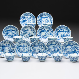 A set of 11 Chinese blue and white cups and saucers with riverscape design, Kangxi