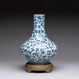 A gilt-bronze-mounted Chinese blue and white bottle vase with floral design, 19/20th C.