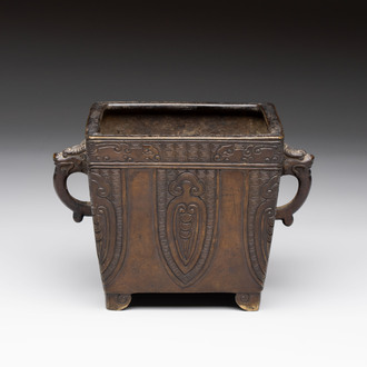 A Chinese archaistic bronze square censer with two handles, Xuande mark, Qing