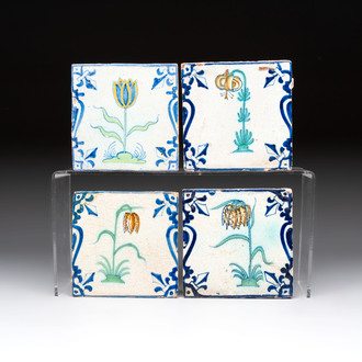 Four polychrome Dutch Delft 'candelabra' tiles with flowers, 17th C.