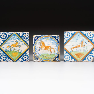 Two polychrome Dutch Delft maiolica 'fox' and 'hare' tiles and a small 'horse' medallion tile, late 16th C.