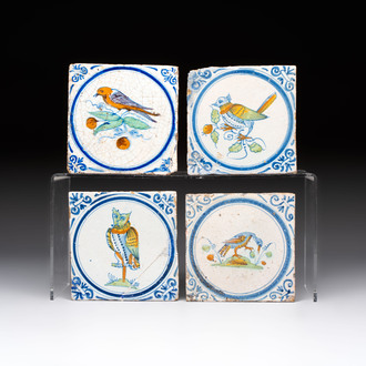 Four polychrome Dutch Delft 'bird' medallion tiles, 17th C.