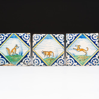 Three polychrome Dutch Delft maiolica 'fox', 'bull' and 'dog' tiles, late 16th C.