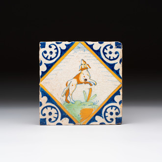 A polychrome Dutch Delft maiolica 'dog' tile, late 16th C.