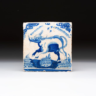 A blue and white Dutch Delft 'crown' 'ox' tile, Rotterdam, early 17th C.