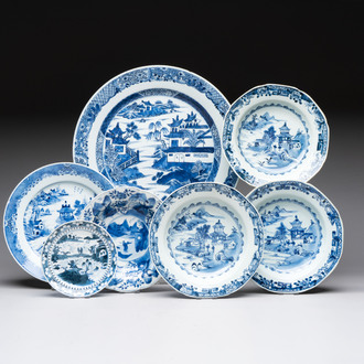 Six Chinese blue and white plates and a dish with landscape design, 18th C.