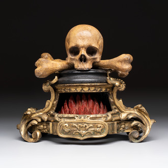 An Italian 'vanitas' or 'memento mori' skull with wooden crossbones on gilt-bronze base, 18/19th C.