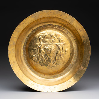 A German brass repoussé 'the Grapes of Canaan' dish, Nuremberg, 17th C.