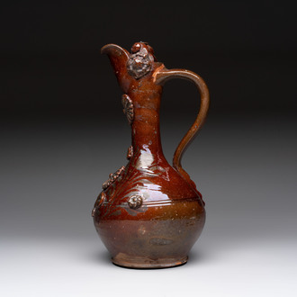 An Ottoman Canakkale pottery ewer with applied floral rosettes, Turkey, 19th C