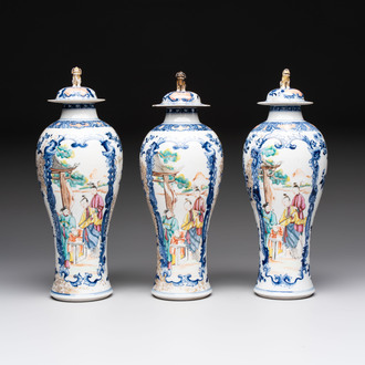 Three Chinese famille rose 'mandarin subject' vases and covers, Qianlong