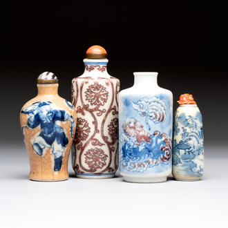 Two Chinese blue, white and copper-red snuff bottles and two blue and white snuff bottles, 19th C.