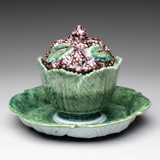 A polychrome Dutch Delft 'mulberries' tureen and cover on stand, 18th C.